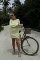 Belle Amour Mercy dress in light green, featuring a flowing cut and soft fabric, styled for elegance.