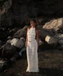 Boho Breeze: Elegant two-piece with ruffled details, featuring a halter top and partially sheer skirt, perfect for summer occasions.