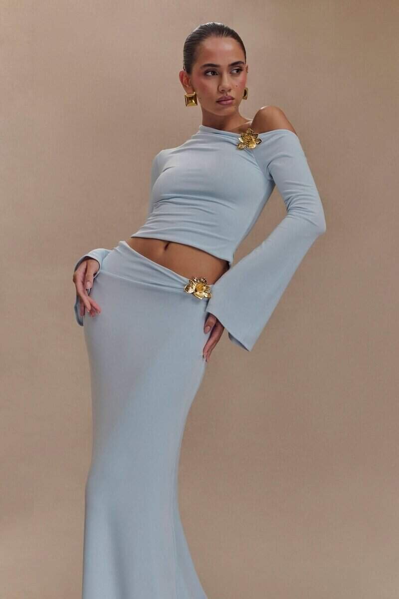 Asymmetrical long-sleeve top and floor-length skirt with floral details from the Celeste Evening Set.