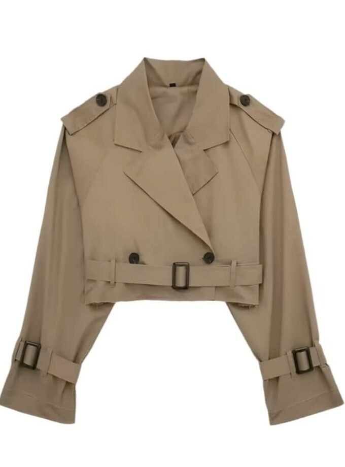 Cropped trench coat with broad lapel collar, shoulder epaulets, and belted waist, made from water-repellent cotton blend.