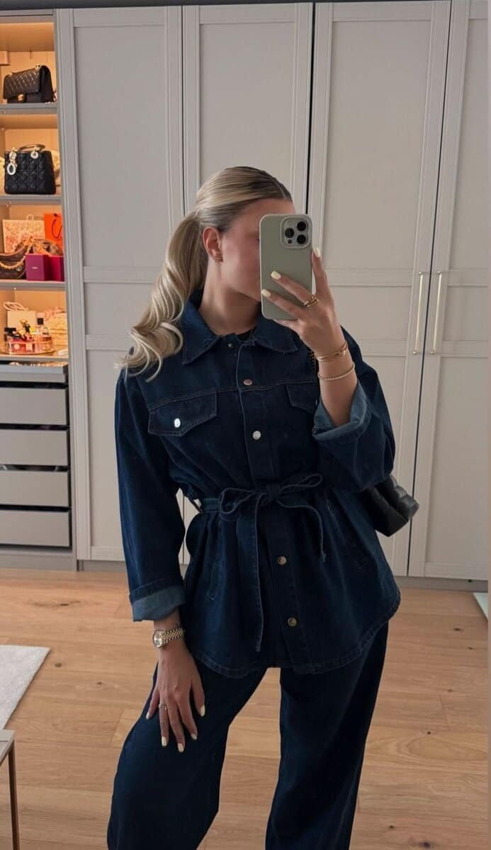 Dark Elegance Denim Set featuring a belted jacket and high-waist jeans in dark wash for a stylish, modern look.