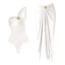 Elegance Beach Set with asymmetrical swimsuit and wrap skirt, featuring gold embellishment for a glamorous look.