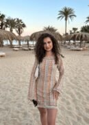 Elle Rose summer dress, breathable fabric, beach setting, feminine details.