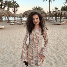 Elle Rose summer dress, breathable fabric, beach setting, feminine details.