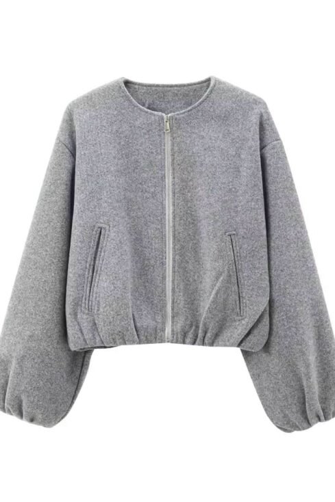 Gray essential balloon jacket with wide sleeves, zip pockets, elastic hem, and minimalist design.