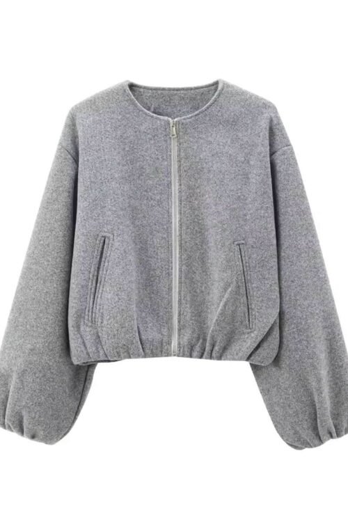 Gray essential balloon jacket with wide sleeves, zip pockets, elastic hem, and minimalist design.