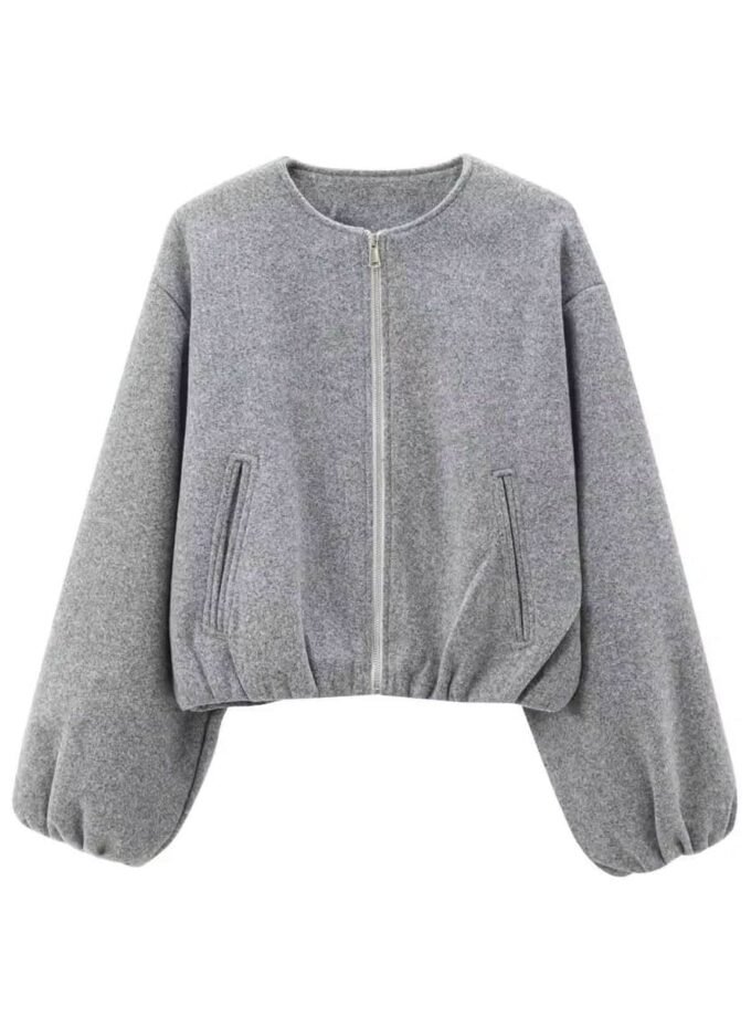 Gray essential balloon jacket with wide sleeves, zip pockets, elastic hem, and minimalist design.