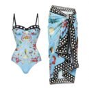 Luxurious 'Maritime Elegance' swim set featuring a shell and coral print swimsuit with a polka-dot trim sarong, in light blue.