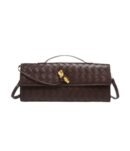 Luxurious burgundy shoulder bag "Royal Weave" with woven design and gold knot detail.