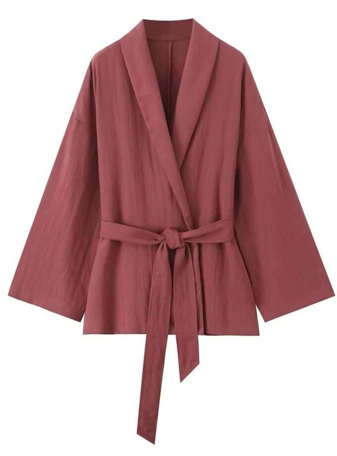 Soft wrap set with a flowing fabric wrap jacket, tie belt, and matching pants in a warm tone.