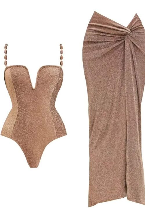 Soleil Glow Set 2-Piece Sparkle Edition featuring a shaping bodysuit with pearl straps and a draped sarong skirt.