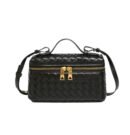 Sophia Woven Classic black crossbody bag with gold zippers and braided details.