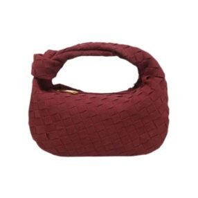 Suede braided hobo handbag with woven design and curved handle.